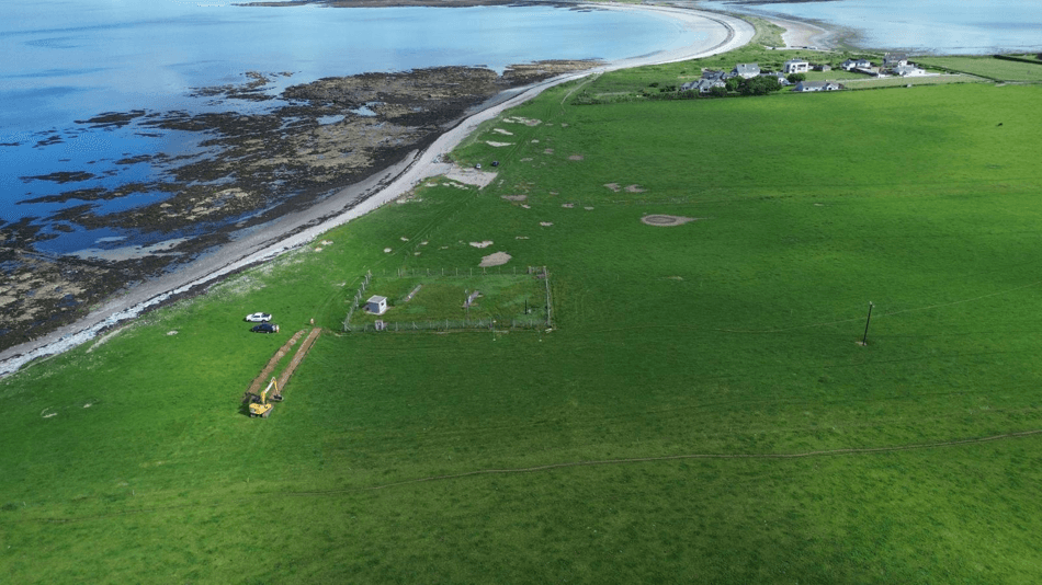 Aerial view of coastal groundworks for a lighting and power installation